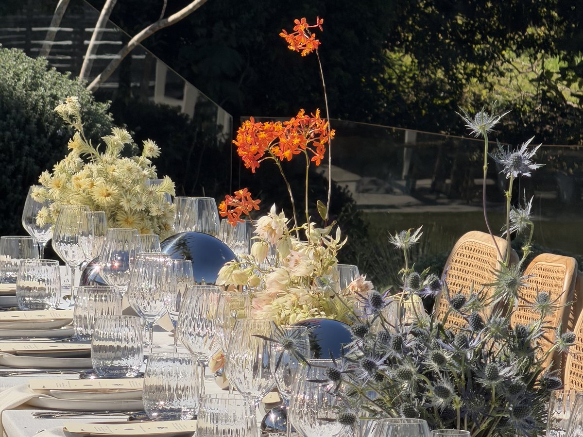 Event table with orange blooms